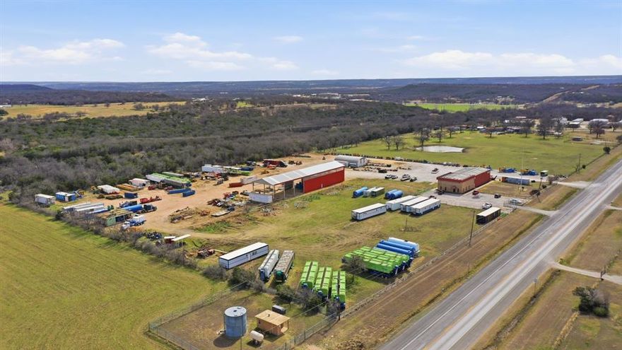Prime 3 acre commercial or industrial parcel located just outside city limits off Highway 337 near Mineral Wells, Texas. This highly visible property offers excellent highway frontage and accessibility, making it an outstanding choice for equipment storage, heavy machinery operations, construction yard, oilfield services, agricultural support, light industrial uses, or related businesses.
Key Features:

Prime Location  Situated just outside city limits with direct access and strong exposure along Highway 337, a key route connecting Mineral Wells to surrounding areas in Palo Pinto County. An easy commute to Fort Worth (approx. 50-60 miles east) and other North Texas regional hubs.
Spacious and Functional Layout  Fenced and leveled 3-acre yard with ample open space for equipment staging, material storage, vehicle parking, or operational expansion.
Versatile Zoning Use  Positioned in an unincorporated area outside Mineral Wells city limits, offering flexibility for commercial, industrial, or flex-use purposes to be confirmed with the county during feasibility. The current setup supports equipment sales, rental, fabrication, storage, or service-based businesses.


This turnkey ready site presents a rare opportunity in the Mineral Wells area for businesses seeking affordable, highway accessible land with existing infrastructure and equipment staging capabilities enhanced by its location just outside city limits for added operational flexibility. Whether you're expanding an existing operation or launching a new venture in construction, oil & gas support, or heavy equipment services, this property delivers exceptional value and versatility.