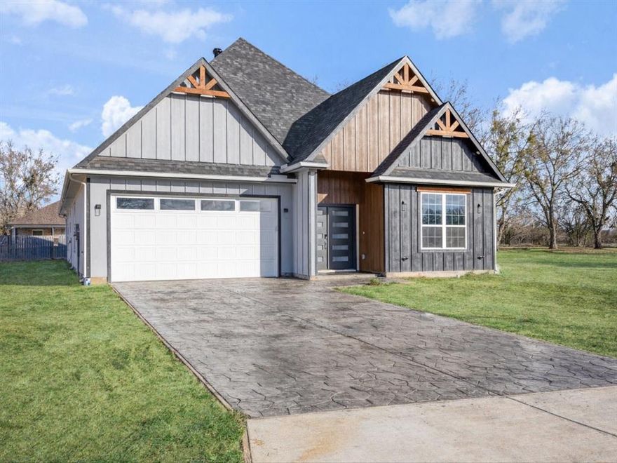 This New Construction home offers 4 bedrooms, 3 full baths, and a versatile flex room perfect for a home office, playroom, or additional living space. Blending modern design with timeless farmhouse charm.
Step inside to soaring ceilings, abundant natural light, and designer lighting throughout. The open-concept layout features a chef-inspired kitchen with custom wood cabinetry, quartz countertops, and a full-height quartz backsplash.
The living room is anchored by a stunning floor-to-ceiling electric fireplace, creating a warm and inviting focal point. Detailed woodwork, crown molding, and custom craftsmanship enhance the main living areas and primary suite.
The private primary retreat offers a spa-like ensuite with custom-built cabinetry, designed for comfort and relaxation.
Enjoy modern convenience with smart front and rear door entry, smart garage access, and dual garage opener controls.
Exterior features include a stamped and stained driveway and front porch, soffit lighting for added curb appeal and security, and installed rain gutters for long-term protection.
This thoughtfully designed home offers the perfect combination of style, function, and comfort