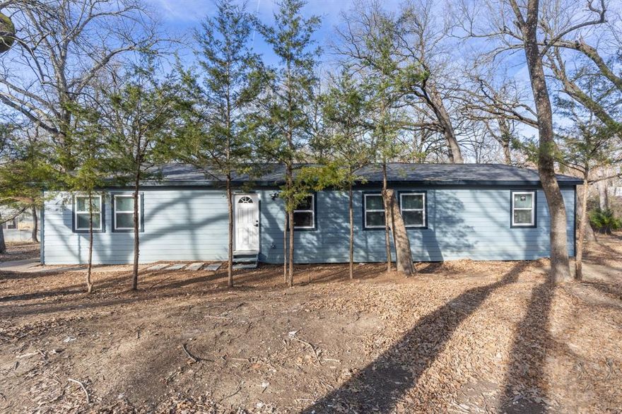 Enjoy the peace and quiet on 1.5 acres, only 15 minutes from Lake Tawakoni. This property includes a 4 bedroom and 2 bath completely remodeled home, second building with power and water that can be converted to a second living quarters, a pond and a creek. no restrictions.