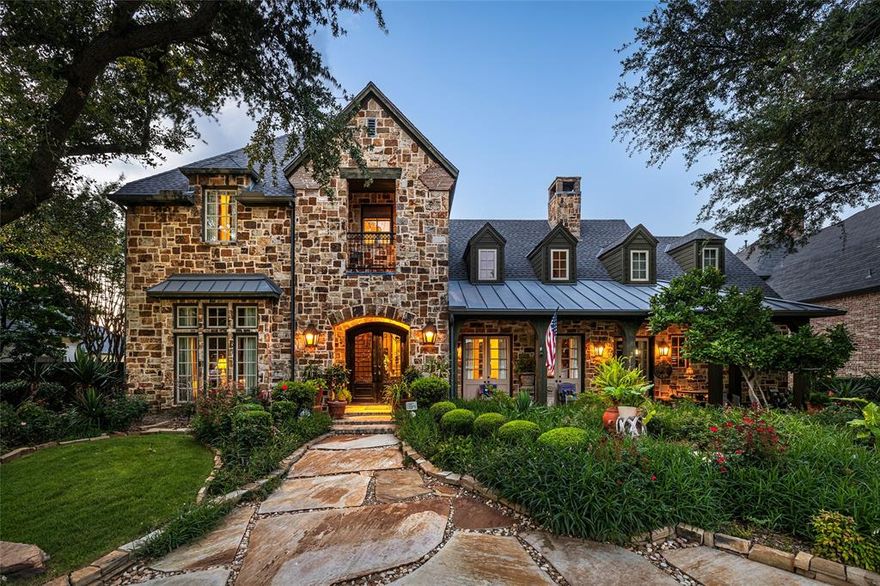 Step in from the Farmhouse exterior into the classically designed interior of this former Parade of Homes luxury property in the sought-after gated Lakes on Legacy Community! Take in the tranquil views of the neighborhood lakes from the expansive front porch and then be greeted by the grand foyer as you enter the home. The great room showcases an impressive wall of stone with a gas fireplace, two sets of French doors with water views, and hand scraped oak wood floors all beneath 100+ year-old reclaimed pine beams. Opposite that you'll find the elegant formal dining room with adjacent butler's pantry leading to a true chef's kitchen. Relish entertaining with the top-of-the-line and professional grade appliances in this natural gathering spot for family and friends boasting beautiful porcelain counters. Flow into the comfortable family room featuring 12-ft ceilings, Venetian plaster walls, cast stone fireplace, more hand-scraped oak floors and a wet bar with hammered copper sink. The handsome study is perfect for focused work or indulgent relaxation with extensive wood paneling, glass-front cabinetry, Ralph Lauren designer carpet, and French doors with more water views. Retreat to a serene primary suite with bay windows overlooking the lush backyard. The luxurious bath features travertine slab counters, jetted tub, frameless shower, dual sinks, and even a vanishing vanity mirror TV! The second floor has so much to offer including 3 bedrooms & 3 full baths (two are en-suite), a large game room with wet bar, a wonderful media room, and a loft office with two workstations, ample cabinetry & a skylight. A tropical paradise awaits you as you step out back to what is a true outdoor living space. Cool off and enjoy the sparkling saltwater pool with spa, several water features and full pool bath off the covered patio. The thought and care put into every aspect of this professional designer's personal home must be experienced to be fully appreciated!