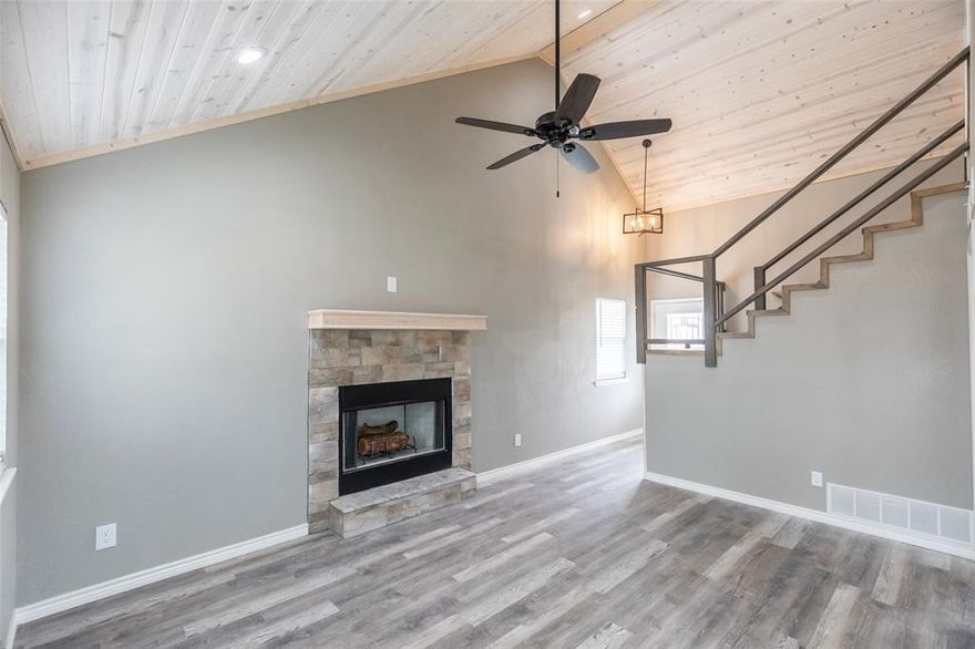 New construction home in Coleman! This two-story property offers approximately 1,203 square feet of living space with 3 bedrooms and 2.5 bathrooms. The interior features vaulted ceilings that create an open feel in the main living area, along with wood accents that add character to the space. The living room includes a fireplace and connects to the kitchen for convenient everyday living. The primary bedroom includes an en-suite bathroom, while two additional bedrooms provide flexible space for guests, family, or a home office. Additional features include a privacy-fenced backyard, providing a defined outdoor space for a variety of uses.