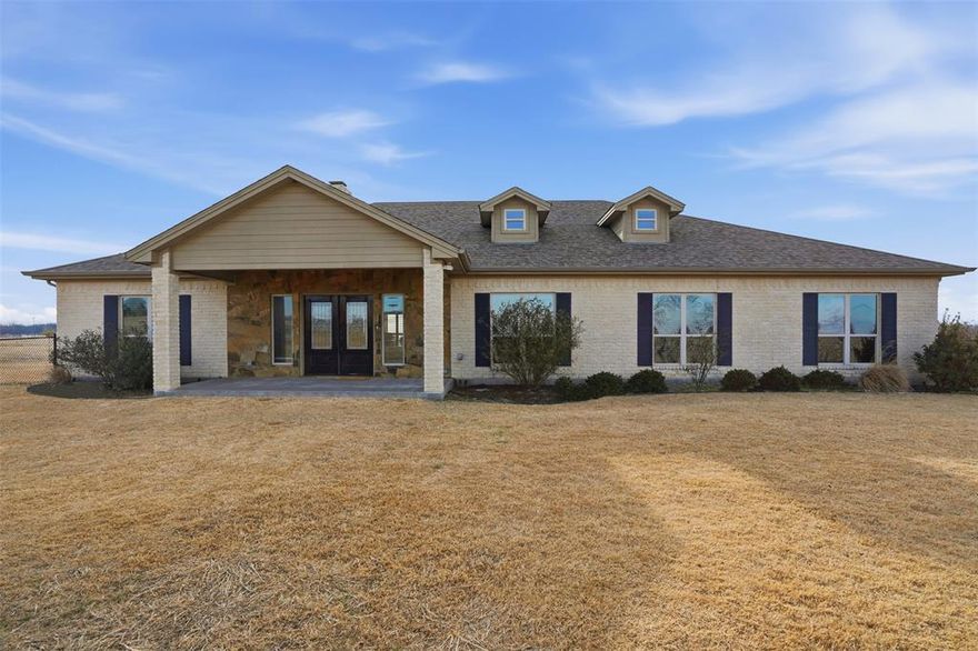 this rare find sits on 10.93 acres just outside the city limits and minutes from town. You step in to the entry and fell right at home with this spacious dining, living room open to gourmet kitchen and plenty of space for entertaining. Living room has windows looking out to the back deck and inground pool and taking in the view of the countryside. oversized wood burning rock fireplace in the living area to keep you all cozy on cold winter nights. Kitchen offers abundance of counterspace breakfast bar large enough to sit 6-8 people, double ovens, cooktop, area for coffee bar, nice size pantry and plenty of cabinet space. Master suite is great in size with built in shelving, two walk in closets with built in dressers and plenty of storage. Master suite bath offers large tub, separate sinks, walk in shower. Three other bedrooms on the opposite side of the house each with their own bath area. Utility room is off the hall area with cabinets and extra storage for all crafts and or hobbies. You can step out back to an inground pool with an accessory unit with half bath and room to have outdoor drinks and snacks. attached to this room is a workshop area and or storage. The property includes a pond at the back and acreage in coastal, ag exempt on the additional acreage.