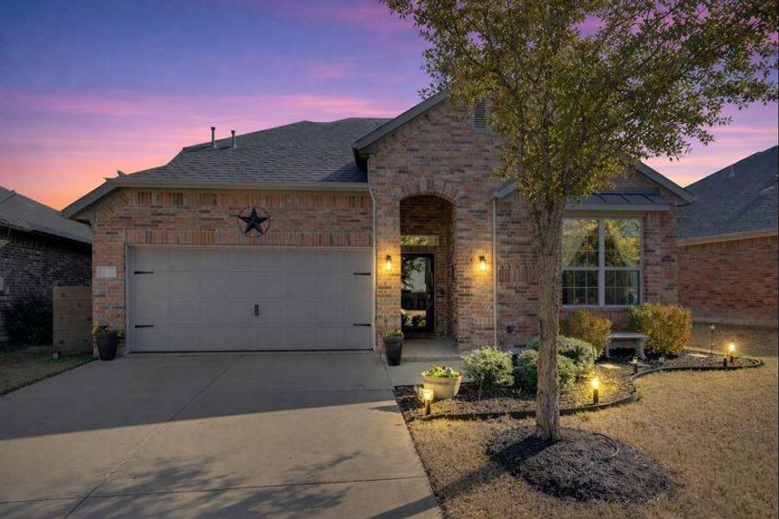 Beautifully maintained home in a very quiet neighborhood in the Roanoke area, located in award-winning Northwest ISD. The roof was replaced in January 2026. This inviting residence offers a smart, family-friendly layout with 3 bedrooms (and flexibility for a 4th bedroom) and 2 full baths downstairs, plus a large upstairs flex room with walk-in closet and full bath—ideal for an additional bedroom, game room, teen space, or guests. Warm, modern finishes and abundant natural light fill the open-concept main living area, featuring beautiful flooring and a cozy fireplace—perfect for everyday living and entertaining. The kitchen opens seamlessly to the living and dining spaces and includes stainless steel appliances, generous counter space, and a breakfast bar overlooking the main living area. A bright dining area with backyard views enhances the home’s welcoming feel. The main level also features an additional flex space ideal for formal dining, home office or sitting area. Enjoy mature landscaping, and a private backyard with spa. The artificial turf provides minimal maintenance to allow more time for outdoor relaxation and play. This quiet community features a splash pad and is conveniently located near shopping, dining, and entertainment, with easy access to major highways. The home combines comfort, versatility, and exceptional value in a highly sought-after school district.