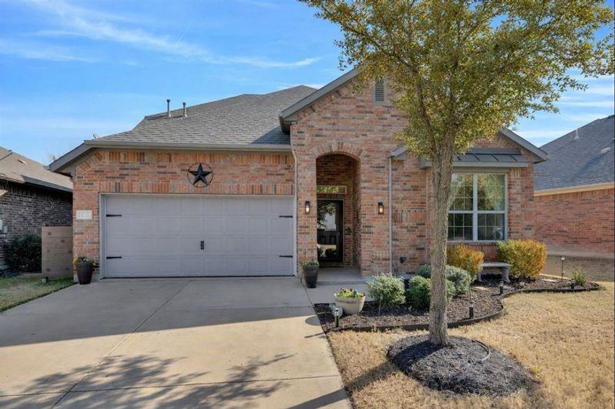 ***OPEN HOUSE SUNDAY, JAN 11, 1:30-3:30***Beautifully maintained home in the Roanoke area, located in award-winning Northwest ISD. (Roof being replaced January 2026) This inviting residence offers a smart, family-friendly layout with 3 bedrooms (and flexibility for a 4th bedroom) and 2 full baths downstairs, plus a large upstairs flex room with walk-in closet and full bath—ideal for an additional bedroom, game room, teen space, or guests. Warm, modern finishes and abundant natural light fill the open-concept main living area, featuring beautiful flooring and a cozy fireplace—perfect for everyday living and entertaining. The kitchen opens seamlessly to the living and dining spaces and includes stainless steel appliances, generous counter space, and a breakfast bar overlooking the main living area. A bright dining area with backyard views enhances the home’s welcoming feel. The main level also features an additional flex space ideal for formal dining, home office or sitting area. Enjoy mature landscaping, and a private backyard with artificial turf providing minimal maintenance to allow more time for outdoor relaxation and play. Conveniently located near shopping, dining, and entertainment, with easy access to major highways, this home combines comfort, versatility, and exceptional value in a highly sought-after school district.