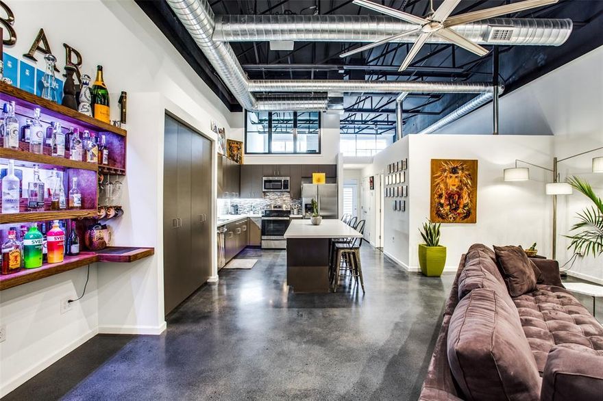 **DEEP ELLUM LOFT ALERT CHECK OUT THE 3D VIRTUAL TOUR ** 15 foot open rafter ceilings and large windows allow for wonderful light throughout and the stained concrete floors create an airy, cool urban vibe in the heart of Deep Ellum. Samsung Fridge, Stainless Steel appliances, New Kitchen with Large Island for Entertaining and private attached garage make the space perfect for the discerning professional. Second level includes 240 sqft flex space above the garage perfect for an office, art studio or yoga room. This is the Loft you've been looking for. Did I mention it has a 1 car private garage....in Deep Ellum! Truly a must see...