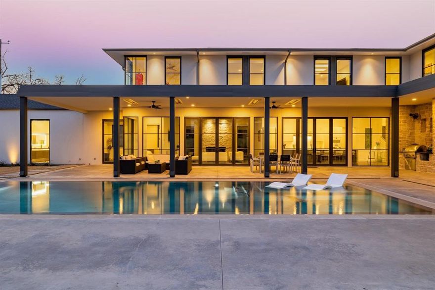 Gorgeous Preston Hollow modern design home that is both contemporary and timeless. Built by luxury home builder, Rosewood Custom Builders who is known for their commitment to quality and creativity in design. This home was meticulously executed with exquisite quality of construction and high attention to detail. Luxury appliances, fixtures, and materials were selected for their stylish appearance, flawless performance, and enduring beauty.

Spacious, open floor plan with walls of floor-to-ceiling windows provides abundant natural light. A stunning glass-enclosed wine room is visible from the dining and entry. The large kitchen features Miele appliances, a Sub-Zero refrigerator-freezer, and a huge eat-around island. The tranquil and private backyard includes a custom negative edge pool and an expansive covered & heated patio with an entertaining & grilling area. The 3 car front-entry garage offers a connection for e-Car charging. Fabulous!