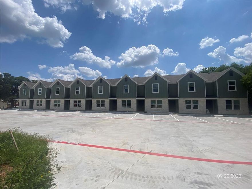 Newly built in summer 2023, this collection of nine townhomes offers a modern living experience close to Tarleton University. Each 3-bed, 3-bath unit boasts an open-concept living, dining, and kitchen area with stainless steel appliances and granite countertops. The ground floor is accentuated with durable stained concrete, while the upper rooms and laundry area feature wood-like vinyl flooring. Primarily rented by individual room, each townhome has a private backyard and covered porch, ideal for pets. Located in a peaceful neighborhood perfect for walks and runs, it presents a prime investment with its proximity to university life and contemporary design. This property has been 100% occupied even with rent increases due to the lack of housing in Stephenville. The location that this one has to the university ensures it's popularity.