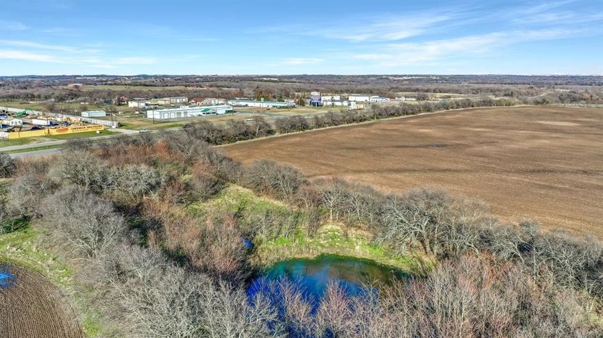 Incredible development opportunity:  148+ acres in prime location in one of the fastest growing areas in the US.  12-inch City of Sherman water line along US Hwy 82.  This property, located near the major intersection of Hwy 289 and US Hwy 82, has close proximity to high-end developments and the North Texas Regional Airport. Approximately 2,122 ft frontage along US Hwy 82 and 2,405 ft frontage along Lamberth offers unparalleled development characteristics.  Sherman's robust industrial base includes Texas Instruments, with a $30B expansion of their semiconductor wafer plant underway, Taiwan-based GlobalWafers has announced a new state-of-the-art 300-millimeter silicon wafer factory. Property includes several ponds, mature trees and ag exemption.  Sewer located nearby.  No flood plain per FEMA flood maps.  Lamberth Road is slated as 4 lane thoroughfare in the future.  Concept site plan and survey available upon request.