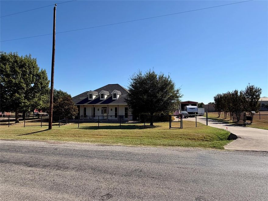 Beautiful 3bd, 2.5 bath custom home sitting on an acre located in Red Oak ISD.  Rooms are spacious.  Lot is fully fenced with pipe fencing and electric gated entrance, nice established trees.  The sprinkler system covers front, sides and back to the garden area.  Tornado room in the oversized garage. Solar panels. Shop is 18x48 with electricity and concrete flooring and has a large storage room with loft.  The storage bldg makes for a cute garage shed or she shed.