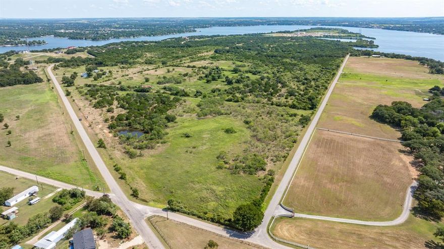 Don’t miss this rare chance to acquire this unique property with endless possibilities—whether you’re thinking development or creating your own private retreat. You’ll find two tanks, paved road access on two sides, and a nice, workable mix of terrain you can fully enjoy. All of this sits just minutes from Lake Granbury and Pecan Plantation, so you get the best of both peace and convenience.