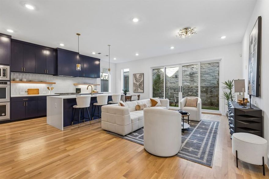 Discover contemporary luxury living at its finest in this architecturally striking 3-bedroom, 2.1-bathroom SFA located at 3959 Bowie Lane in The Reserve at Bluffview, a premier master-planned community located in the heart of Dallas, TX, offering a luxurious and active lifestyle for residents of all ages.  This meticulously designed 2,200 square foot residence showcases clean, modern design inspired by Dutch architecture, offering an exceptional blend of style, functionality, and sophisticated finishes throughout.  This exceptional home stands apart from others with three highly coveted upgrades!  Double ovens, both a luxurious tub and shower, and a private outdoor patio, perfect for dining and entertaining!
The heart of this home features an impressive open-concept living area with soaring ceilings and abundant natural light. The gourmet kitchen boasts custom cabinetry, a large center island with seating, premium countertops, and top-of-the-line stainless steel appliances.  The seamless flow between the kitchen and living areas creates an ideal space for both daily living and entertaining.  The gated community amenities include expansive manicured lawns and green spaces, custom fire pit area with Adirondack seating, and a covered pavilion for outdoor dining and lounging.  3959 Bowie represents an exceptional opportunity to own a piece of contemporary architectural excellence in one of Dallas’s most desirable neighborhoods. Perfect for discerning buyers seeking sophisticated, low-maintenance luxury living with impeccable design, premium finishes, and resort-style community amenities that create a true lifestyle destination.