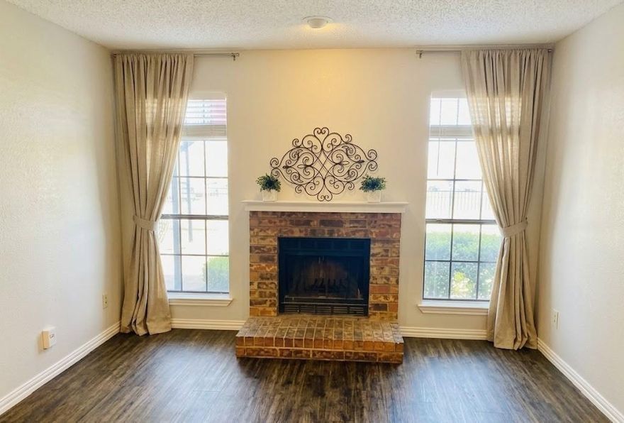 Fully updated, move-in-ready first-floor condo located in North Dallas within the highly acclaimed Plano ISD. This residence features an open-concept layout highlighted by luxury vinyl plank flooring and a neutral color palette that enhances the natural light throughout the home. The central living area includes a classic brick wood-burning fireplace, providing a focal point for the space. The kitchen is equipped with an included refrigerator and microwave for added convenience.

The oversized primary suite features a large walk-in closet and direct access to a private covered patio. This outdoor space includes an exterior storage closet and offers views of the community pool. Notably, this residence is the only unit in the complex featuring a private gate with direct access to the pool area.

Ideally situated for easy commuting, the property is minutes from Central Market, the North Dallas tech corridor, and the University of Texas at Dallas. This home includes assigned parking space 108 and provides quick access to major freeways, dining, and retail destinations. Schedule your showing today to view this unique North Dallas property.