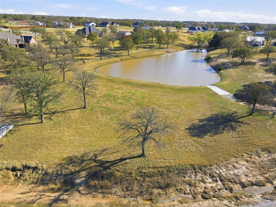 Discover the perfect blend of space, freedom and natural beauty with this 3.2 acre homesite with a pond that's located in the existing subdivision of las Brisas. This future homesite offers country living with gorgeous mature oak trees throughout and scenic view of private pond for relaxing views, wildlife, or light recreational use. This is a rare opportunity to own average with flexibility, privacy and long term value. Ideal for custom home buyers that can bring their builder, equestrian use or anyone seeking space without sacrificing convenience. Whether you're planning a custom home, small ranch or a peaceful retreat this land delivers space and no city taxes that are increasingly hard to find.