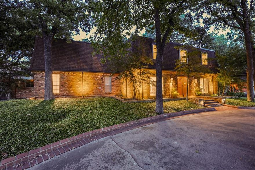 Prestigious Shady Valley Estates French Chateau

In one of Arlington’s most coveted neighborhoods, this sprawling French chateau in Shady Valley Estates sits on an oversized lot shaded by mature trees, with peaceful golf course views right out front. The location? Absolutely unbeatable. You’re just 10 minutes from Arlington’s Entertainment District, 30 minutes from Dallas or Fort Worth, and practically a chip shot away from Shady Valley Country Club and Golf Course.

Inside, you’ll find a home that’s all charm with just the right amount of character. Real brick floors stretch through the formal and casual living spaces, and thanks to the new smart home lighting, every room can be as bright as your future here. Cozy up next to one of the two fireplaces on chilly evenings or host the dinner party of the year in the oversized dining room that easily seats twelve...with a chef’s kitchen ready to rise to the occasion. Stainless steel appliances, farm and prep sinks, endless storage, and counter space for days mean you can handle anything from Tuesday tacos to Thanksgiving feasts.

Upstairs, there’s room for everyone. A media room for movie nights or gaming marathons, a spacious flex room with a wet bar for playtime, homework, or a second living area, plus a second primary suite with golf course views — perfect for in-laws, guests, or anyone who just loves a good view.

Need even more space? The private apartment or office suite above the garage is ideal for guests, college kids, au pairs, or even a home-based business.

Step outside and you’ll find plenty of places to relax and entertain — a covered porch, a fire pit, a roomy deck, and a generously sized backyard. And when that still isn’t enough, there’s extra green space right across the street for even more room to play.

This home blends elegance, personality, and a location that’s second to none — a true Shady Valley gem that checks all the boxes.