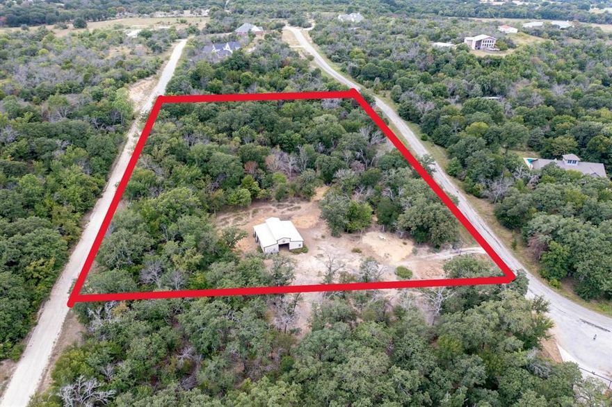 *ACERAGE* Nestled in the Hilltop of Ft Worth, is this beautiful 5 acre treed with with hardwoods. Just located 20 Minutes to Dtwn Ft Worth and 50 min to Dallas! Property features a fully fenced including a pipe gated entrance, a functional 5 stall barn with dutch doors and plenty of shade for your livestock. Electric is available at the front of the property by gate. Currently AG Exempt and outside the city limits. Owner will Not subdivide, this property will need to sell after or in conjunction with property MLS# 21037161.