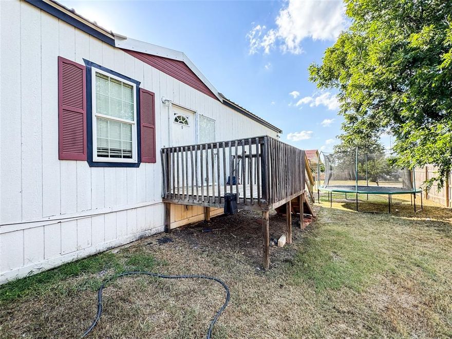 Affordable 3-Bedroom, 2-Bath Home Close to Downtown Cisco!
This 2014 well-kept 3-bedroom, 2-bath single wide mobile home is just a short walk to unique shops & eating establishments. Inside, you'll find a nice, open layout featuring a generous living room, a well-equipped kitchen with center island, and a dining area that's perfect for gatherings or family meals. The master bedroom is privately located and includes a full ensuite bath with a large soaking tub and separate shower along with a roomy walk in closet. Two additional bedrooms and a second full bath are situated down a hallway off of the living room.  The exterior features a deck off of the front entryway for morning coffee.  The backyard is great for play, pets, or cookouts.  It also includes a large concrete slab ready to be converted in to a basketball court, or possibly even a pickleball court.  A new metal roof was installed at the beginning of 2025.  What a great place to be!!