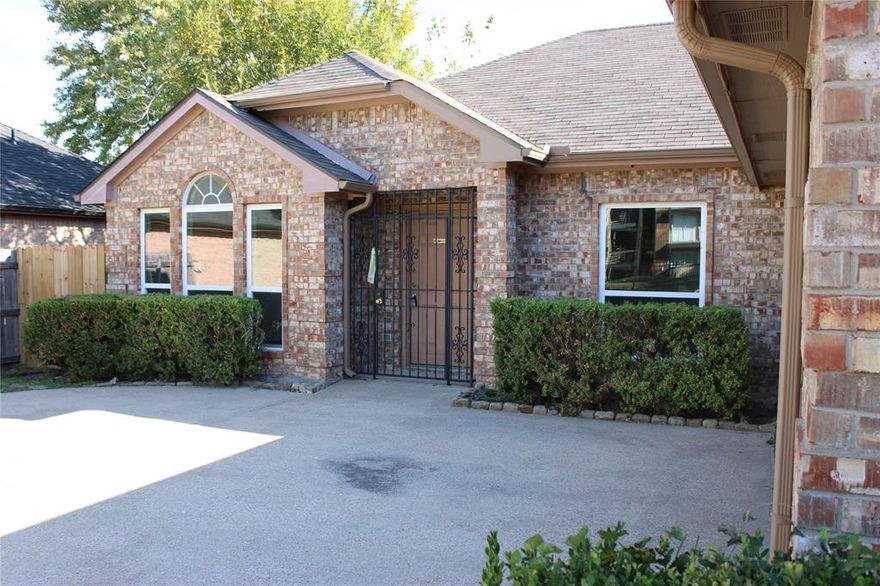 Step inside this charming traditional home where comfort, function, and timeless appeal come together beautifully. From the moment you enter, you’ll notice the warmth of natural light streaming through bay windows and the sense of space created by tall ceilings, an open floor plan, and thoughtful design. The inviting living area centers around a cozy wood-burning fireplace—perfect for family gatherings or quiet evenings at home. The kitchen is the heart of the home, featuring granite-look counters, abundant cabinetry, a breakfast bar, and a full suite of appliances ready for your culinary creations.

With five spacious bedrooms, there’s room for everyone to enjoy their own retreat. The primary suite is a peaceful escape with a sitting area, dual sinks, a relaxing garden tub, separate shower, and an oversized walk-in closet designed for convenience and comfort. Each bedroom includes ceiling fans and ample closet space, ensuring everyone stays comfortable throughout the seasons.

Step outside to a large backyard framed by mature trees, privacy fencing, and plenty of room for pets, play, and weekend entertaining. Whether you’re grilling on the covered patio or enjoying the evening breeze, this outdoor space offers a relaxing backdrop for everyday living.

Additional highlights include attractive laminate and tile flooring, fresh neutral tones throughout, a two-car side-entry garage, full laundry room, decorative lighting, and energy-efficient features like a smart thermostat and double-pane windows.

Situated in a quiet, established neighborhood with sidewalks and easy access to Loop 12, I-30, and major Dallas thoroughfares, this home offers quick commutes to downtown, hospitals, shopping, and dining. Within the highly regarded Skyline High School feeder pattern, this home perfectly blends location, comfort, and value.

Move-in ready and beautifully maintained—this one truly checks all the boxes.