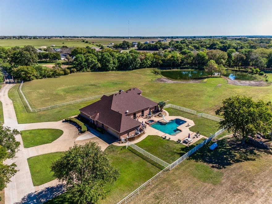 Motivated Seller! Seller said make an offer! Fabulous property on 17 ACRES with5 stall barn & 90 x 30 Corral with tack room makes this perfect family retreat property and lovely location for your animals! NO CITY TAXES and a 6 mile drive to historic downtown Waxahachie and centrally located to both I-45, I-35 and HWY 287 with just 30 minutes to downtown Dallas!  This beautiful 4-bedroom, 4-bathroom home is a spaciously designed home boasts comfort and style. With generously sized rooms, each bedroom offers its own unique charm, ensuring plenty of space for everyone. The four full bathrooms add a touch of convenience and luxury, making it easy to accommodate family and guests.  Perfect family home for both everyday living and entertaining, this home boasts open living areas filled with natural light and modern finishes. Wonderful swimming pool for those hot Texas summers. Located in the heart of Waxahachie, you'll enjoy the charm of a small-town community with all the amenities nearby. Don’t miss the chance to call this stunning property your new home! A creek cuts through the property and Outdoor enthusiasts will be excited to fish in the large stocked pond with a lighted dock. This fabulous home provides all the amenities for your very own country estate.