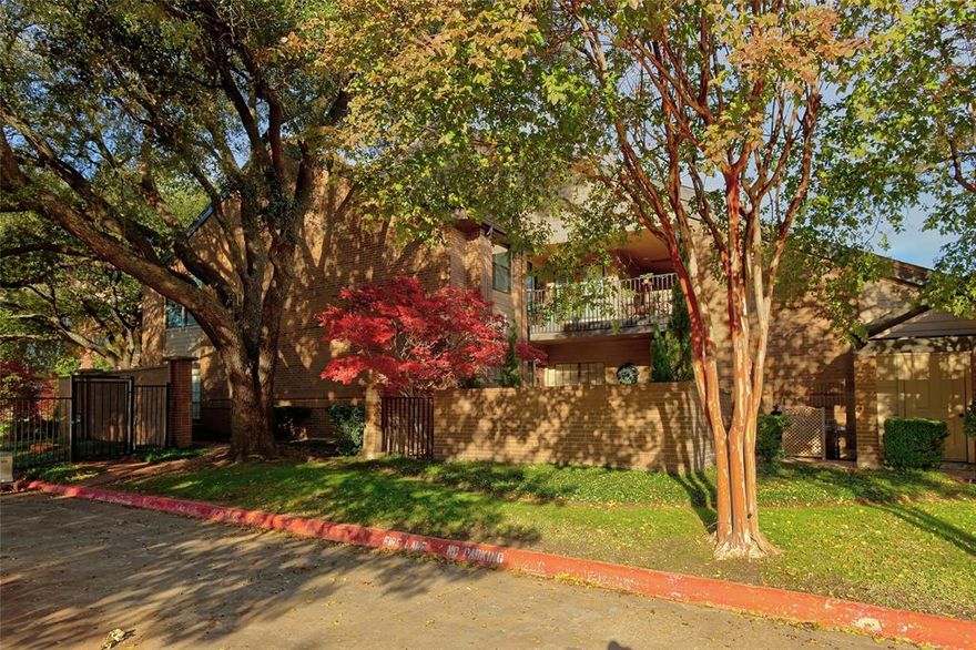 Welcome to your own treehouse retreat! Nestled among a canopy of mature trees, this end-unit condo on the second floor offers a sense of privacy and serenity that is hard to find. With lush greenery and a peaceful setting surrounding the unit, you'll feel removed from the fast city pace — yet right in the heart of one of North Dallas' most sought-after locations. The community includes and features a beautiful waterfall pool and tennis court and is ideal for the lock-and-leave lifestyle. Worth mentioning that the HOA has strong reserves, is very responsive and meticulously maintains community grounds. Step inside this unit to find vaulted ceilings in the dining and living rooms, floor-to-ceiling windows, and an abundance of natural light throughout the unit. Plantation shutters add a clean, finished look to every window. The living room features a cozy fireplace and opens to a floorplan that flows naturally, including two private balconies among the treetops. The kitchen offers granite countertops, black appliances, and updated white cabinets. The primary bedroom is generously sized with a full bath featuring a stand-up shower, garden tub, dual vanities, and ample closet space. The secondary bedroom is large enough for a roommate, family member, or home office, with a full bath just steps away. Sellers have invested approximately $30,000 in upgrades since 2021, including all-new aluminum Low-E windows (2022), luxury vinyl plank flooring (2021), a new AC unit (2023), and a new hot water heater (2021). The refrigerator, washer and dryer convey, making this truly move-in ready. A private garage with additional storage space and a covered parking spot completes the package. Bonus attic space above the garage provides convenient extra storage area for personal belongings. Adjacent to the prestigious Bent Tree Country Club, minutes from popular Addison, and with quick access to the DNT and GB Tollway, DFW and Love Field are just 15–20 minutes away.