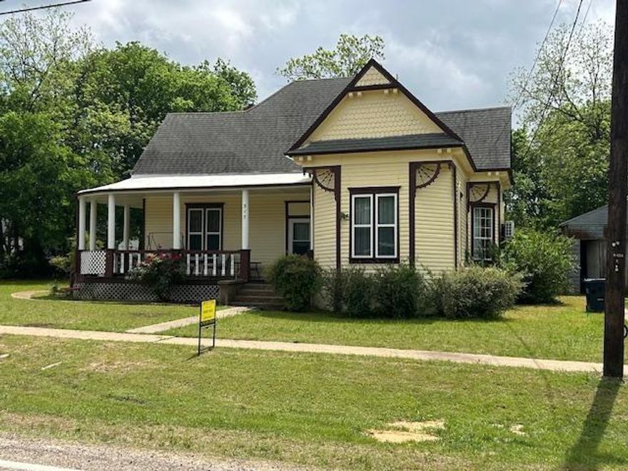 3440 sf - 5Br - 2Ba on .44 ac IN TOWN close to the beautiful City Park and Duck Pond.  This Whimsical Craftsman style home with Victorian Flair offers  so much room for the whole family and then some. The large rooms connect throughout as to hardly cross paths while entertaining. Each room has an accent to the era of 1910 with decorative fireplaces and gingerbread woodwork that frames the entry.  Original turn-style doorbell, high ceilings and an attic so large with easy access to hold all the seasonal decor and extra treasures.  Property sits on .44 ac, large yard for play and a highly vintage all metal, wood frame, two small car garage or great storage area.  Amazing curved covered front porch, a well sized back porch and a balcony from the second floor with a birds eye view overlooking the large backyard.  This home offers many years to a new family to make memories galore and call it home.