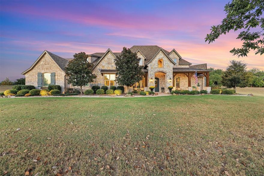 This immaculate custom home, sits on an elevated homesite in a quiet Lovejoy ISD community featuring stone accents, wood floors, plantation shutters, custom cabinetry, outdoor living with a retractable screened-in patio, a beautiful pool, and a transfer switch for a portable generator. Designed for comfort, functionality, and timeless style, this stunning home offers 5 bedrooms, 5.5 bathrooms, a private study, and a spacious gameroom, providing flexible living for everyday life and entertaining.Set on generous acreage, the thoughtfully designed floor plan blends elegant finishes with inviting living spaces filled with natural light. The outdoor living area creates a true backyard retreat—perfect for year-round enjoyment, relaxation, and hosting family and friends.Located in the highly sought-after Lovejoy Independent School District, this exceptional property offers the rare combination of luxury finishes, acreage living, a private pool, and top-rated schools—all within convenient proximity to shopping, dining, and major commuting routes.