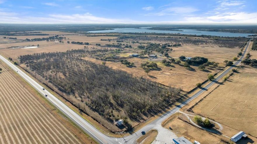Prime commercial and recreational opportunity on 47 acres located at the high-visibility corner of Highway 377 and FM 1476. This exceptional tract offers endless potential—ideal for a gas station, RV park, convenience store, or a combination of uses.

Public water is available, a major advantage for commercial development, and the property also includes one water well. The sandy loam soil is great for a variety of uses, from construction to agriculture.

Situated just ½ mile from Lake Proctor, this property is perfectly positioned to capture traffic from locals, lake visitors, and travelers. More or less acreage is available depending on buyer needs.

A rare chance to secure a strategically located tract in a rapidly growing area—bring your vision and maximize this property’s full potential.