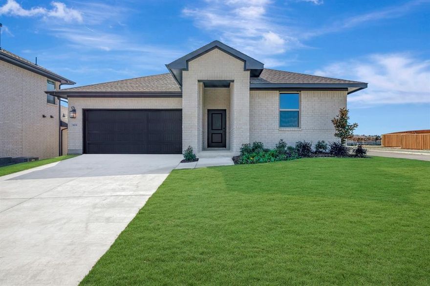 From dawn to dusk and from outside-in, this home is a showstopper! Located in Van Alstyne, Texas and zoned to Van Alstyne ISD, this single-story Goldenrod II features a stunning brick exterior, beautiful landscaping, and an open concept floorplan. Off the foyer are two convenient secondary bedrooms and a full bath in between. At the back of the home is the inviting kitchen, great room, and dining area. With gorgeous light stain shaker cabinets and quartz counters lit by black metal shade pendant lights, the kitchen is one to love for years to come. The primary suite and bath will have any homeowner feeling spoiled with the expansive walk-in closet and spacious shower.