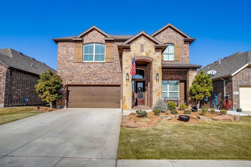 Welcome to this beautifully upgraded 5-bedroom, 4-bath home built in 2017, located in the highly desirable Northwest ISD! Designed with both functionality and style in mind, this home offers modern finishes, thoughtful upgrades, and flexible living spaces.

The main level features tile flooring throughout, fresh interior paint, recessed lighting, and a spacious open layout. The primary suite and one secondary bedroom are conveniently located downstairs, along with two full bathrooms—ideal for guests or multigenerational living. Custom plantation shutters enhance every room, while in-ceiling speakers and upgraded indoor and outdoor light fixtures add comfort and ambiance.

Upstairs, you’ll find a large living area perfect for entertaining, a game room, or play space, along with three additional bedrooms and two full bathrooms.

Additional upgrades include built-in cabinetry in front entryway, epoxy garage floor with built-in cabinets, Vivint security system with cameras, and a reverse osmosis water filtration system at the kitchen sink. The home also features a Class 4 roof, which qualifies for a home insurance discount.

Outside, enjoy a well-maintained front and backyard with landscape lighting, extended flatwork, and built-in entertainment features including a RecTec smoker and kegerator—perfect for hosting and outdoor living.

This move-in-ready home combines modern convenience, quality upgrades, and an exceptional location.