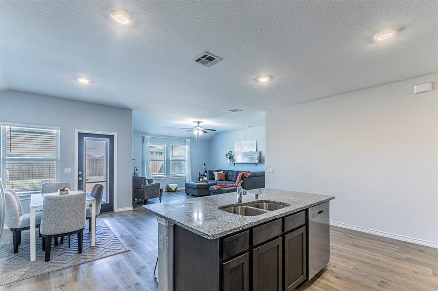 PRICE IMPROVEMENT!! Welcome to this lovely 4-bedrooms, 2-bathrooms, single story brick home located in a N. McKinney newer development (homes built between 2023-2025). It's a popular country meets suburban setting and sits in the highly sought after Melissa Independent School District. Offering over 1800 sq ft of living space this house opens to an airy layout where wood-like laminate plank floors sweep through the entrance into the kitchen, dining, & family living areas, perfect for family gatherings and everyday living. The natural sunlight creates a warm & inviting atmosphere in your modern kitchen, that includes granite counter tops, stainless steel appliances, eat-at island and a large walk-in panty for all your storage. 3 bedrooms are located in the front of the house, & one could easily function as a study, playroom, or quiet room for those serene moments we all savor. The primary bedroom is a great size & positioned in the back of the house for privacy. Large windows to brighten the room & the en-suite that includes dual sinks, stand alone shower, linen shelving, & an ample walk-in closet. The energy efficient Low-E windows and programable thermostat helps you keep your rooms temps where you want them. The spacious 2-car garage provides plenty of room & has a classy epoxy floor & it's where you find your tankless hot water heater for those endless showers. Step outside to a large fenced backyard-perfect for relaxing and enjoying your morning coffee on the covered patio & spend evenings grilling or just enjoying the backyard. This home combines comfort, style and an exceptional location. It's minutes from US-75, and accessible to shopping, dining and parks. Come See!