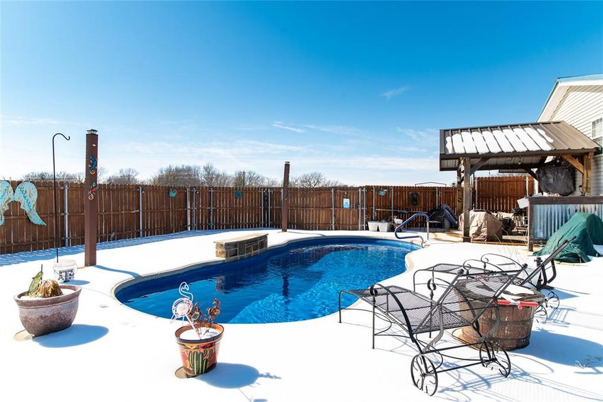 Welcome to your private slice of Texas paradise! Situated on 5 fully fenced acres with a gated entrance, this spacious property offers the perfect blend of comfort, functionality, and outdoor living. The home features 4 bedrooms, 3 full bathrooms including a jack and jill bathroom, and two generous living areas, providing plenty of space for everyday living and entertaining. Step outside and enjoy your own in ground saltwater pool, ideal for summer gatherings or quiet evenings at home. For those needing extra space, the property includes a large barn with electricity, another metal building with 2 roll up garage doors, and an additional 2-car carport, offering endless options for vehicles, equipment, hobbies, or livestock. Safety and peace of mind are covered with a large underground storm shelter capable of accommodating up to 10 people. Whether you’re looking for room to roam, a place to work and play, or a private retreat with modern conveniences, this property truly has it all. New windows installed 2 years ago. Upgraded 5 ton HVAC system. Saltwater Pool with privacy fence was installed in 2018. New salt cell for the pool was installed in November.