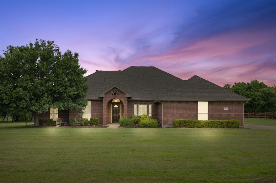 Nestled on just over an acre in the quiet Vista Oaks community, this beautifully maintained single-story home offers the perfect balance of space, privacy, and convenience. Located in the highly sought-after Wylie ISD and just minutes from Lake Lavon, this property delivers peaceful country-style living while still being close to shopping, dining, and major commuting routes.

Step inside to discover over 2,500 square feet of thoughtfully designed living space featuring 4 spacious bedrooms and 2.5 bathrooms. The inviting open-concept layout is filled with natural light and anchored by a warm and welcoming living room with a wood-burning fireplace, creating the perfect space to gather with family and friends.

The kitchen flows seamlessly into the main living area, making entertaining easy and everyday living comfortable. Generous cabinetry, ample counter space, and a functional layout make it ideal for hosting holidays, casual dinners, or morning coffee before starting the day.

The primary suite offers a private retreat with plenty of room to relax, while the additional bedrooms provide flexibility for guests, a home office, or growing households. Thoughtful design elements and comfortable living spaces throughout the home create a warm and welcoming atmosphere.

Outside, the expansive backyard and covered patio offer endless possibilities for outdoor enjoyment. Whether you’re hosting weekend barbecues, enjoying quiet evenings under the Texas sky, or dreaming of adding a pool or workshop, the large lot provides plenty of room to make it your own.

With a 3-car garage, generous lot size, and close proximity to Lake Lavon, this property offers the rare opportunity to enjoy space, privacy, and convenience all in one. Experience the best of North Texas living in this peaceful Saint Paul retreat.