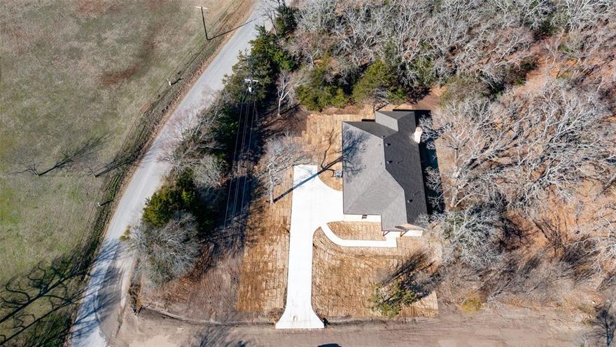 Gorgeous New Construction home on just shy of 1 acre located on a corner lot! NO HOA!  Perfectly placed in a quiet country setting but only a few miles from Quinlan downtown conveniences, parks, restaurants and shopping. House features 4 bedrooms, 3 bathrooms, a huge family area, fireplace, and open floor plan. Beautiful large kitchen island, granite countertops, beautiful subway tile, stainless steel appliances, farmhouse stainless steel sink, Beautiful large master suite with vaulted ceilings, large walk-in master closet, beautiful luxury tiled master shower, luxury Shower wall panels tower system with LED rainfall waterfall shower head plus hand shower, massage jets! Luxury tiled flooring in main areas, mudroom area with custom bench and hooks, spacious laundry room, large 2 car garage with side entrance, landscaping and so many more beautiful custom features. Just one look at this home and you will fall in love. The builder spared no expense on this one!