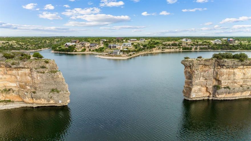 Explore an extraordinary opportunity at Possum Kingdom Lake! Nestled in the sought-after Cliffs Resort, this 0.33-acre cul-de-sac lot invites you to craft your dream lake home. Enjoy tranquility while being close to remarkable amenities – from complimentary rounds on the 18-hole championship golf course to the marina, spa, fitness center, and tennis. With its level terrain, the lot offers versatile building options to suit your dream design. Don't miss out on this amazing chance – come explore today and envision the exceptional lifestyle awaiting you!
