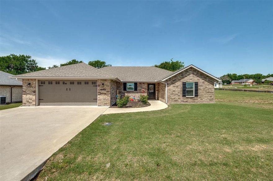 Pride of ownership is abound in this 4 Bed 2 Bath Blue Ridge Texas home. This home boasts an open floor plan with custom features that combine beauty, convenience, and efficiency. Features include luxury vinyl plank flooring that is as attractive as it is tough, custom window coverings with the option of black-out, custom cabinets with pull out trash bin, built-in hampers in both bathrooms, dual sinks plus vanity in primary bathroom, nice sized walk-in closets in all bedrooms, coat and linen closets, utility with custom cabinets and custom shelf for folding clothes or added storage. Other great features include Spray Foam insulation added for efficiency, Wifi garage, Doorbell Cam, added electrical outlets, eave plugs that are operated by a light switch, and lots of storage in the attic.  This home has child proofing that can remain or be removed.  Fence in backyard can be pushed back to property line to make backyard larger. Play ground equipment and basketball goal are included, or can be removed upon closing.
