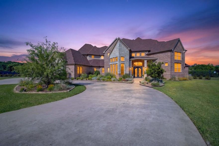 Exquisite Home set in a Gated Community centrally located between Burleson, Mansfield & FW. This  home offers the perfect blend of luxury, space & country living on 3.16 beautifully landscaped acres in cul-de-sac with circular driveway & ample parking. This home is an impressive 6448 sf, with 5 generously sized bedrooms all with its own private ensuite with a total of 6.5 baths. Multiple living & entertaining spaces define this home, including 3 living areas, 2 fireplaces, large kitchen with refrigerator that can stay, double convection oven, wine cooler, & wine rack, 2 dining areas with built-in buffet, a home office with lots of built-ins & storage, a dedicated media room, with 2 grand staircases leading to the 2nd level & a 3rd staircase leading to a versatile bonus room with built-ins & a sink. The oversized primary room has a fireplace, sitting area, with pool access. Primary bath has a locking storage closet and large walk-in closet. There are full sized utility rooms on the 1st & 2nd levels.Thoughtfully designed for both grand entertaining & comfortable everyday living. Step outside to your private resort-style retreat with a brand new outdoor kitchen, gas grill, ice bucket, fridge & a place for pizza oven, sparkling pool with water features, pool cabana & lots of space for relaxing & entertaining. The property extends far beyond the wrought iron fence, has an astroturf fenced dog area & a fully stocked fishing pond at the back of the property. The 4 car oversized garage provides ample space for vehicles, storage & hobbies. Attic spaces with hallway access, intercom system, hard wired for cameras & security system. Roof is 6 yrs old, 4 total HVAC systems (3-5 yrs old and 1 brand new.)  See Documents for a list of all the updates to the property.  Ag Exemption possible due to fish, turtles & birds living in & around the pond.