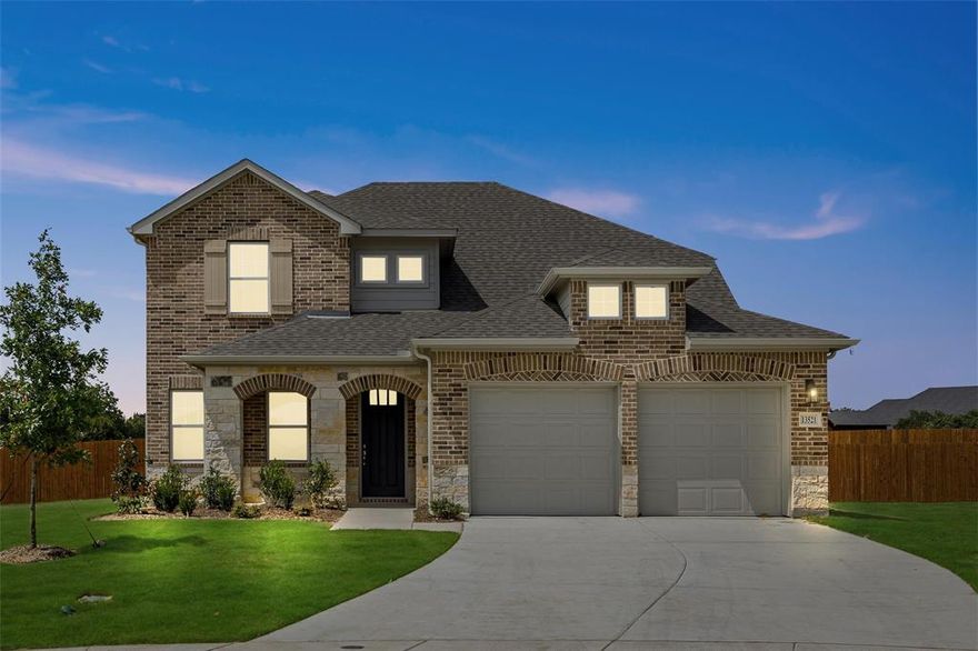 MLS# 20395592 - Built by Ashton Woods Homes - Ready Now! ~ New home in Northwest ISD, mins to I35W Hwy 287, and 18 miles North of downtown Fort Worth. Upgrades inside and out. ACME brick and stone, 8 foot front door w glass & large covered front porch. 2-story 4-3-2 w. upgraded flooring, solid surface countertops, moen faucets, open concept, large eat-in bar top island w. pendant lights, gray 42-inch cabinets, undermount stainless steel single bowl sink, mosaic backsplash ceramic tile, a pull-out waste basket, Moen faucet, Energy Star Whirlpool stainless steel appliances with a built-in microwave and oven, cooktop, dishwasher & walk-in pantry. Primary suite dual sink vanities, ceramic tile shower w. glass enclosure, garden tub, ceramic tile flooring, walk in closet, lighting & towel bars.  HUGE yard w. full sprinkler system, landscaping package, gutters, covered patio, fully fenced in private back yard w. gate, 8ft front door!!