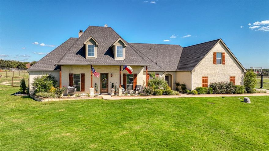 Nestled in the coveted Silverado on the Brazos, this stunning home offers an exceptional blend of style and comfort. The open floor plan and soaring vaulted ceilings create an inviting space, perfect for family gatherings and entertaining guests. A spacious breakfast area seamlessly transitions to a covered outdoor living retreat, fully equipped with a grill, fireplace, and fridge, ensuring year-round enjoyment. The bedrooms in this home are top notch! This property is truly unique – it’s the only one in Haciendas with a separate lot attached that allows horses. With two access points, the back pasture is easily reachable from both Silver Saddle Circle and the backyard. It also features a 36x12 loafing shed, which can be left open or divided into three stalls, offering flexible use. Additionally, there's an AC-equipped tack room, making it even more convenient for those who love equestrian activities. This property offers a rare combination of luxury living and practical functionality!