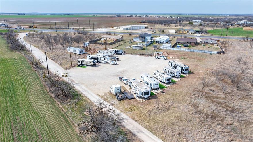 This well-positioned corner lot, set back from the road for added privacy and reduced traffic noise, offers a unique opportunity with 10 established RV sites, making it ideal for income-producing use or a private multi-RV setup. Although the parcel is a corner lot, access is provided from one street, allowing for a more controlled and secluded entry. The setback from the roadway creates a quieter, more peaceful environment for occupants while still maintaining convenient access. Located in Clyde ISD, the property is equipped with water, electric, and septic, providing ready hookups for each space. The layout allows for smooth entry and exit, easy maneuverability, and efficient parking circulation. Whether you’re looking to continue operating as an RV lot, develop a long-term rental configuration, or establish a private RV retreat, this property offers versatility and strong potential. Existing infrastructure helps reduce startup costs and development time, making this an attractive investment or owner-use opportunity in a growing area.