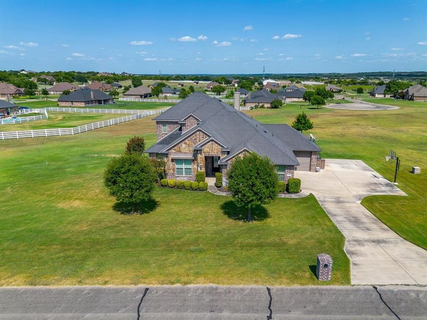 Welcome to your perfect retreat, a well maintained home offering the peace and privacy of country living with the convenience of Fort Worth and Granbury just minutes away. 105 Legacy Downs welcomes you home with rich features such as beautiful hardwood floors and arched doorways, plus an easy flowing floorplan and outdoor living space that make relaxing and entertaining a breeze.

Sitting on just over an acre, your yard is the perfect spot for anything from corn hole to football. Enjoy a quiet morning coffee on the expansive covered back porch and in the evening entertain friends and family with plenty of space for everyone. End your day with incredible stargazing in the country skies. 

The openness of this elegant home makes it perfect for entertaining. The kitchen is spacious with granite countertops and it leads into a dining area with ample views of the back yard. The large living area has rich hardwood floors and a stone fireplace that are cozy and welcoming. 

Downstairs, you’ll find the primary suite which offers plenty of room, privacy, and an ensuite. The guest suite is also downstairs and has its own full bath. The study is a perfect place for your home office, library, or music room. Upstairs offers a large game room with two bedrooms and a full bath. 

Your vehicles are at home in the two car garage and an additional garage is perfect for your mower, tools, bicycles, sports equipment, or extra storage.  

Legacy Pointe neighborhood offers highly rated Aledo schools plus seasonal activities such as Boo Bash for Halloween and a special visit from Santa via the Cresson Fire Department. Enjoy lake time as Lake Granbury and Lake Benbrook are both nearby.
This home blends comfort, elegance, and functionality all in one while its location offers the best of both country living and city convenience. Schedule  your showing to see for yourself what makes this home truly special.