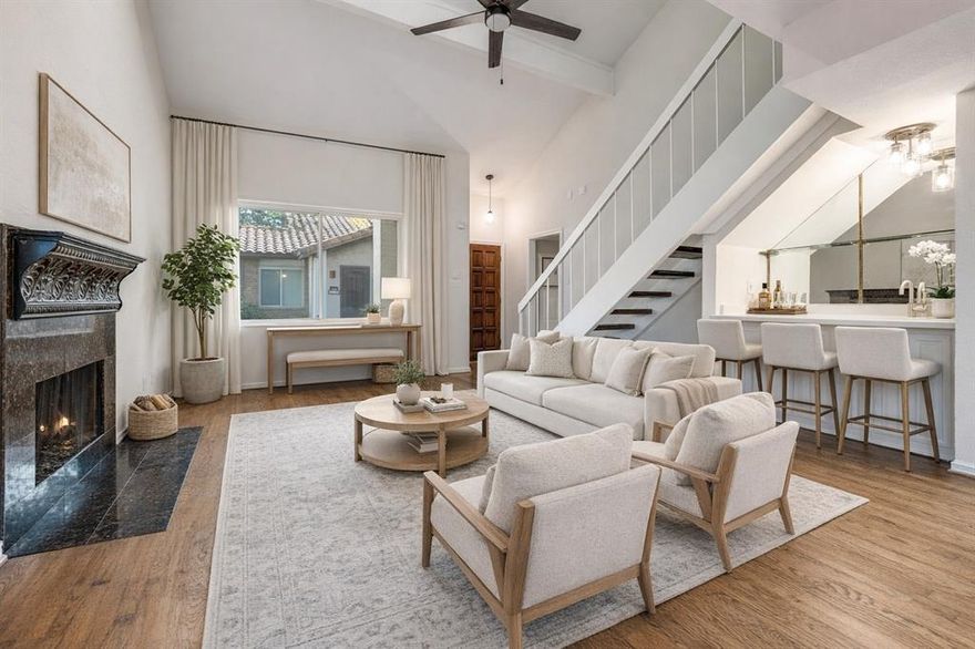 Beautifully refreshed and designed for effortless living, this 2-bed, 2-bath condo blends style and convenience within a gated community featuring a pool. The main level showcases refinished hardwoods, fresh paint, upgraded light fixtures and fans, and an elegantly updated kitchen with new tile, counters, and sink. The sunlit living room with fireplace opens to a private patio, creating a seamless indoor–outdoor experience. Both bedrooms offer the opportunity to serve as the primary suite—choose the first-floor option for easy access or the upstairs retreat for added privacy, complete with updated bath finishes, a private balcony, and a loft ideal for an office, fitness space, or lounge. With exterior maintenance handled by the community and unbeatable access to premier dining, shopping, and major thoroughfares, this lock-and-leave residence delivers low-maintenance luxury in a prime location.