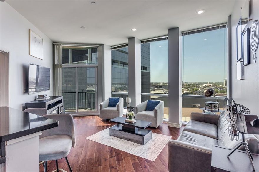 Elevated Living Above the Fort Worth Skyline - A rare floor plan with room to breathe — and views that take it away! One of the most versatile floor plans in The Tower! This stunning 9th-floor, 1BD-1BA condo delivers 972 sq ft of refined downtown living with hardwood floors throughout, floor-to-ceiling windows, and breathtaking western sunset views. The open kitchen flows effortlessly into the main living area — ideal for entertaining. A bonus rear room expands your options well beyond a typical one-bedroom: think home office, guest retreat, media lounge, or reading room. The primary suite features a custom Elfa closet system and ensuite bath. Step outside and experience true walkable urban living — the building's ground floor features retail and upscale dining, while Bass Performance Hall, comedy clubs, and art studios are just steps from your front door. Building amenities include 24-7 concierge, resort pool & hot tub, dedicated pet area, state-of-the-art fitness center, common area party room, and fire pit area. Live where Fort Worth comes alive! Schedule your VIP Showing Today! Deeded parking space 584B - located inside the reserved parking area.