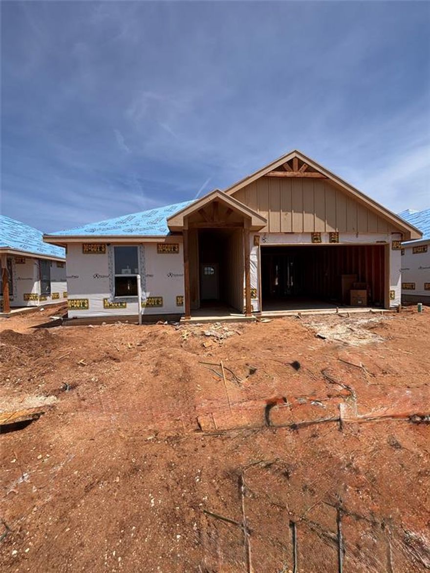Experience luxury living at an affordable price in this beautifully crafted new construction home located in the highly desired Fairway Oaks Village Subdivision, just minutes from the Fairway Oaks Golf Course. This thoughtfully designed brick home blends upscale finishes with everyday comfort, making it the perfect place to call home. Step inside to find soaring 9’ and 10’ ceilings and abundant natural light pouring through energy-efficient 6-foot windows, creating an open and inviting atmosphere. The kitchen is both stylish and functional, featuring a gas cooktop and modern conveniences ideal for cooking and entertaining. Designed with efficiency and ease in mind, the home includes a tankless water heater, insulated garage doors, and an Ecobee smart thermostat for year-round comfort. Blinds and a refrigerator are already in place, offering a true move-in ready experience. Enjoy outdoor living on the covered back porch, complete with a an additional gas line for all of your outdoor cooking needs. Smart home features like Ring cameras at the front door and driveway provide added security and peace of mind. Situated in a prime location within one of the area’s most sought-after new subdivisions, this home delivers the perfect combination of luxury feel, modern features, and affordability—just a short drive from golf, dining, and more.