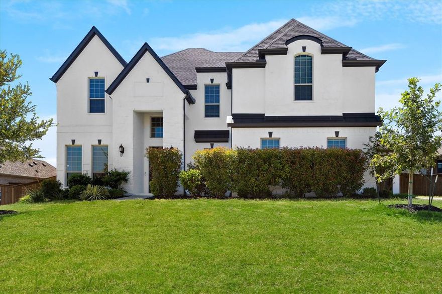 Nestled in the prestigious Falls of Prosper, this exquisite two-story custom-built Harwood Home offers an inspired blend of contemporary sophistication and timeless comfort, all within the award - winning Prosper ISD. 
Set on an expansive over a third acre lot, the property invites endless possibilities—from lavish garden parties to the backyard pool oasis of your dreams. The freshly painted exterior and interior exude modern elegance, while gleaming hardwood floors flow effortlessly throughout the open, light-filled layout.

At the heart of the home lies a chef’s kitchen appointed with stainless steel appliances, striking granite countertops, and a generous island, all embraced by soaring ceilings and an inviting floor plan designed for both everyday living and grand entertaining.

The primary retreat is nothing short of luxurious—spacious and serene, complete with a large walk-in closet and a spa-like ensuite featuring granite countertops and elevated finishes.

Upstairs, immerse yourself in the ultimate cinematic experience in the fully-equipped media room, complete with movie screen, projector, and surround sound speakers—perfect for unforgettable movie nights.

Step outside to the fully enclosed screened-in back porch, where a remote-controlled adjustable screen provides year-round comfort. Whether you're enjoying the warmth of the outdoor fireplace, catching the game on the mounted TV, or savoring a quiet evening breeze, this patio was made for living.

Additional features include:

Epoxy-coated floors in both garages for effortless maintenance and sleek appeal

Spacious layout designed for indoor- outdoor entertaining

A rare combination of privacy, luxury, and charm in one of Prosper’s most sought-after communities

This home is a true gem - schedule your tour today before it’s gone with the breeze.