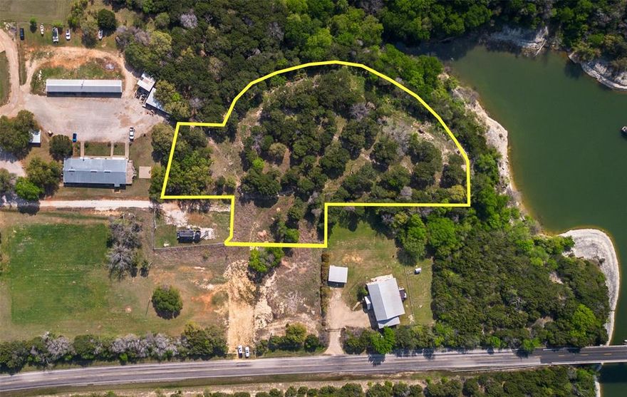 Calling all developers! This is a very unique listing. The owner has a full set of development plans that can convey with this sale. There is approval from TxDOT for this project. The County has already approved the exiting three phase development and can be used for a quick turn time on breaking ground instantly. The lot next to this property was donated to Hilco from this owner and because of that there is full approval for all water meters and sewer. The best part is it’s right on Lake Whitney! If you are familiar with this area then you know it’s hard to find any property on Lake Whitney. From a developer standpoint you know all the hard work has been done with all the approval. You can break ground quickly and generate a great return with the plans that will convey. If you want to do something completely different that’s also an option! The seller is willing to subdivide before closing if you do not want to have this much land or you just need a smaller price point. The other option is 2.4 acres at $850k and the sellers willing to carry $300k with a 4.7% rate. Call for more details and we can go over the extensive details of this wonderful development project! This price point wouldn’t be the three phase development since this is based on the property being divided in half. The full parcel is 5.2 acres for 1.2M. Call to schedule a showing!