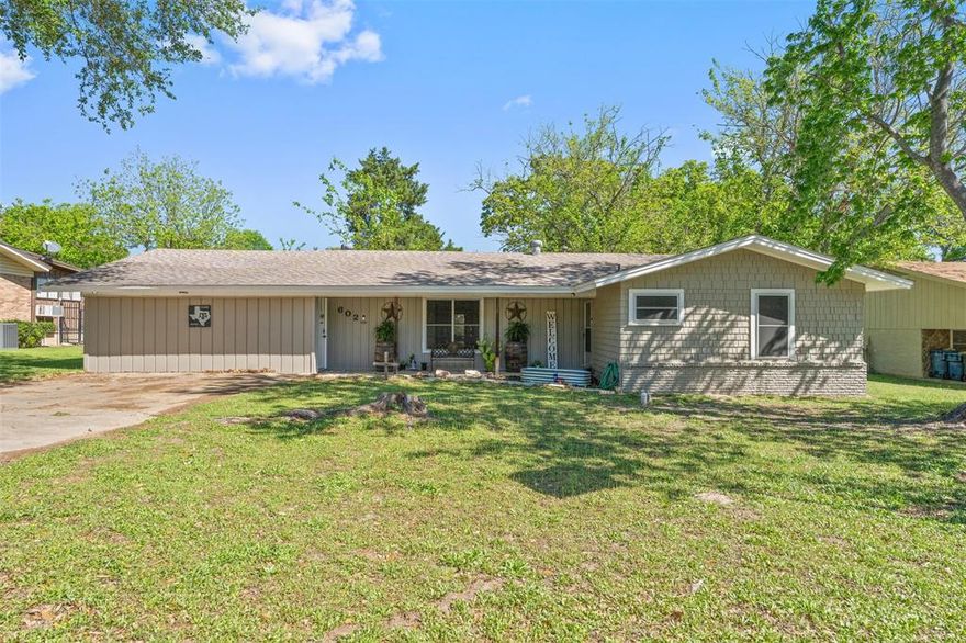 This inviting home offers character and comfort with beautiful original brick floors that add warmth and timeless appeal. The spacious layout includes three bedrooms, two full bathrooms, spacious kitchen and dining area that flows perfectly to the living area.
The kitchen provides generous storage and workspace and opens nicely to the main living areas, creating a comfortable flow for everyday living and entertaining. Large windows allow natural light to fill the home while offering peaceful views of the backyard and the treed land that borders the nearby golf course. Step outside to enjoy the large backyard with a veiw of the near by golf course and mature trees providing natural privacy and a scenic setting. This home combines classic charm, functional space, and a desirable location near the golf course, making it a wonderful opportunity for buyers looking for comfort, character, and a peaceful outdoor setting.