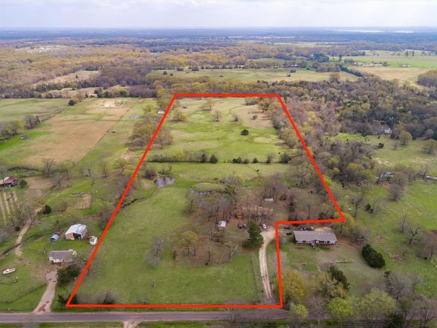 Unlock the possibilities with this 18-acre ag-exempt property located outside city limits, in the peaceful countryside of Yantis, TX—just minutes from world-renowned Lake Fork, known for its trophy bass fishing and outdoor recreation. Whether you're looking to build, invest, or develop, this property offers exceptional value, flexibility, and location.
The land features a blend of open pasture and scattered trees, making it ideal for a custom home, weekend retreat, small ranch, or subdividing into multiple homesites. With existing utilities in place (water, electric, and septic – buyer to verify), you’re already a step ahead.
A non-livable manufactured home currently sits on the property, and the seller is offering up to $10,000 in concessions to assist with its removal—giving you a head start on clearing the way for your vision.  Property Sold As-Is!