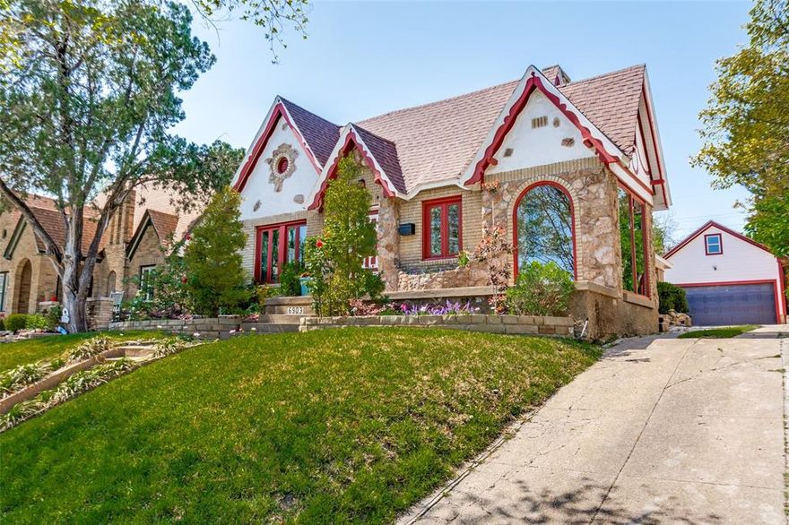 Charming  Storybook Tudor in Lakewood Elementary and the coveted Hollywood Heights neighborhood, blending timeless architectural charm with a comfortable modern floorplan. Full of authentic Tudor character, this one-of-a-kind home is perfect for anyone seeking historic architectural details paired with modern livability.

Beautiful period features include stone accents and planters, original millwork, plaster walls, and a dramatic stone embellished  fireplace. A charming center hall showcases an original built-in phone niche, a rare and delightful historic detail.

The large kitchen features maple cabinetry, granite countertops, ceramic flooring, direct backyard access, center island,  and a distinctive tin ceiling. Hardwood floors run throughout the home.

The spacious primary suite offers walls of windows, abundant natural light, and a walk-in closet. Bathrooms are thoughtfully updated: the primary bath includes cherry cabinetry with crown molding, decorator tile floor, and quartz countertops, while the hall  bath features a custom one of a kind dramatic vanity, clawfoot tub, porcelain tile flooring, ceramic wainscoting, tin ceiling, and crown molding.

A charming enclosed front sunroom with tin ceiling makes a perfect office or reading space. Additional highlights include a center hall bath and a front bedroom with walls of windows.

Step outside to a stunning backyard retreat featuring a patio with an architectural pergola designed to mirror the roofline, a garden area, sprinkler system, and a rare newer garage with extra-high 10 foot ceiling & floored storage above—offering excellent potential for a future studio or living space.

Ideally located near White Rock Lake, the Baylor Medical District, Downtown Dallas, the Santa Fe Hike & Bike Trail, major highways, golf courses, parks, and all the dining and shopping Lakewood has to offer.