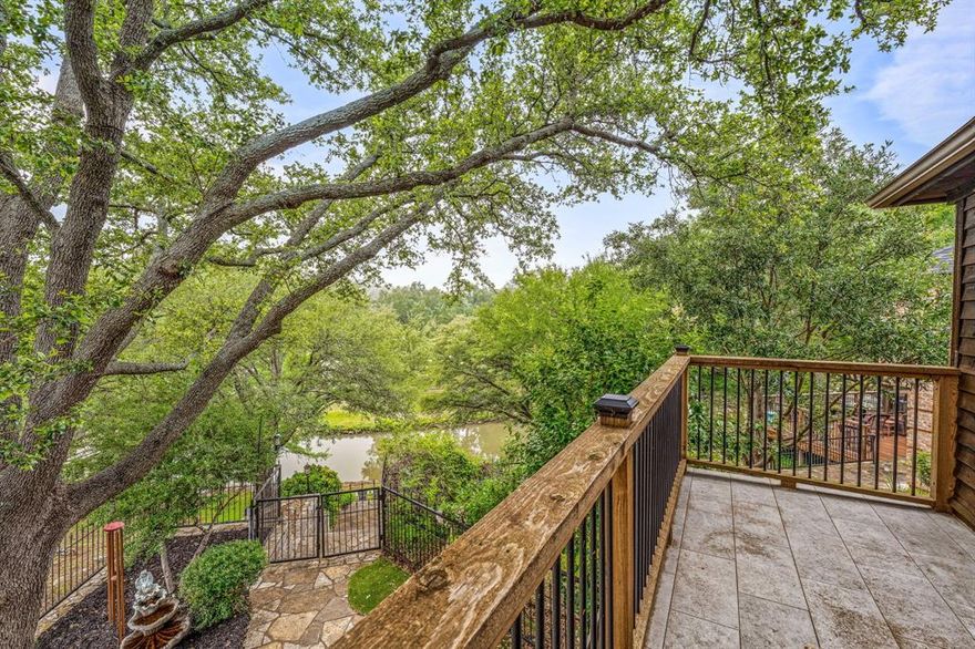 Absolutely charming home overlooking Walnut Creek, navigable to Lake Granbury and located in DeCordova Bend Estates Country Club.  Soaring ceilings in living area that is open to the kitchen and dining areas.  There is a quaint and cozy reading room complete with library shelves and wine rack just off of the main living area.  Updated kitchen with granite counters, farm house sink and an oversized center island perfect for gatherings of friends and family. There are TWO fireplaces in this home, a gas fireplace in the living room and a wood burning fireplace in the downstairs master bedroom.  The downstairs bedroom is huge and would make a fabulous 2nd master or use it for a second living area or home office.  The upstairs bedrooms have fresh paint and new floors and the en suite baths for both bedrooms have been completely and beautifully redone.  Outside you will love the screened porch overlooking the creek and the back yard.  The landscaping is gorgeous, and you will enjoy over 50' of creek frontage, navigable to Lake Granbury.  Fishing and Kayaking from your back yard never looked better and you can build a boat dock at this lot (pending application and approval of the Brazos River Authority). DeCordova Bend Estates and Country Club offer 2 Golf Courses, a full service Clubhouse, full time security, tennis courts, community pool, and much much more.