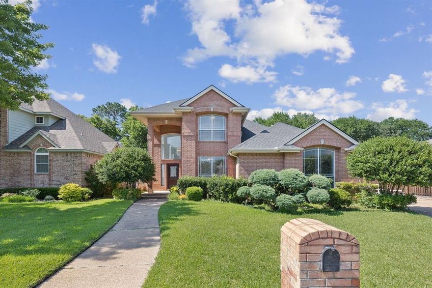 **Stunning custom-built residence** nestled in the coveted Marina Shores enclave of Arlington, TX, exemplifies elegant lakeside living with refined comfort and design. Situated on nearly half an acre, this 4-bedroom, 3-bathroom home welcomes you with soaring ceilings and a bright, open layout that flows seamlessly across multiple living areas, each featuring a cozy gas fireplace ideal for both relaxed evenings and formal entertaining. The heart of the home is the chef-inspired kitchen, complete with granite countertops, a central island, and a spacious walk-in pantry, perfectly suited for those who love to cook and entertain. A formal dining room just off the entry sets a sophisticated tone for unforgettable gatherings. The luxurious primary suite is a private retreat featuring an oversized ensuite bath with dual vanities, a jetted tub, separate shower, and generous walk-in closet. Three additional bedrooms provide flexible living arrangements for family or guests. Step outside to enjoy a covered patio that offers year-round enjoyment and views of the expansive backyard, ideal for outdoor dining, play, or future customization. **The 3-car garage provides abundant space for vehicles, storage, or a workshop area.** Located near Lake Arlington and within the Arlington ISD, this exceptional property offers a rare blend of tranquility, space, and accessibility. Experience timeless design and comfortable luxury in one of Arlington’s most desirable neighborhoods.