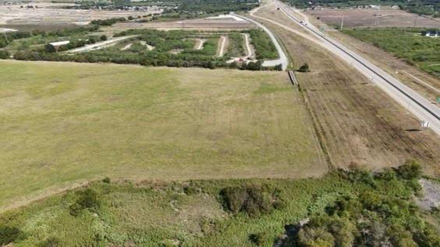 Introducing a prime 32 acre parcel with 894 feet of frontage along the prestigious Chisholm Trail Parkway, conveniently located on the Cleburne and Joshua border. The front 4.5 acres are nestled within the Cleburne city limits, providing unique development opportunities.This exceptionally level property is ideal for both commercial development and industrial use. Don't miss this rare chance to acquire a stunning piece of land with immense potential. Seize the opportunity today!